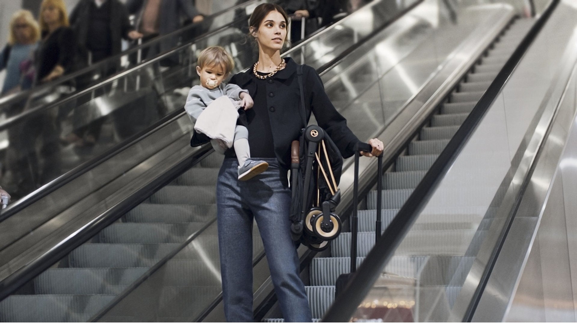 Cybex Coya carried over shoulder  with carry strap